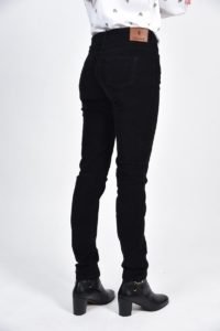 ROSIE - Luxury Stretch Needlecord Jeans 3 lady wearing black needle jeans side view